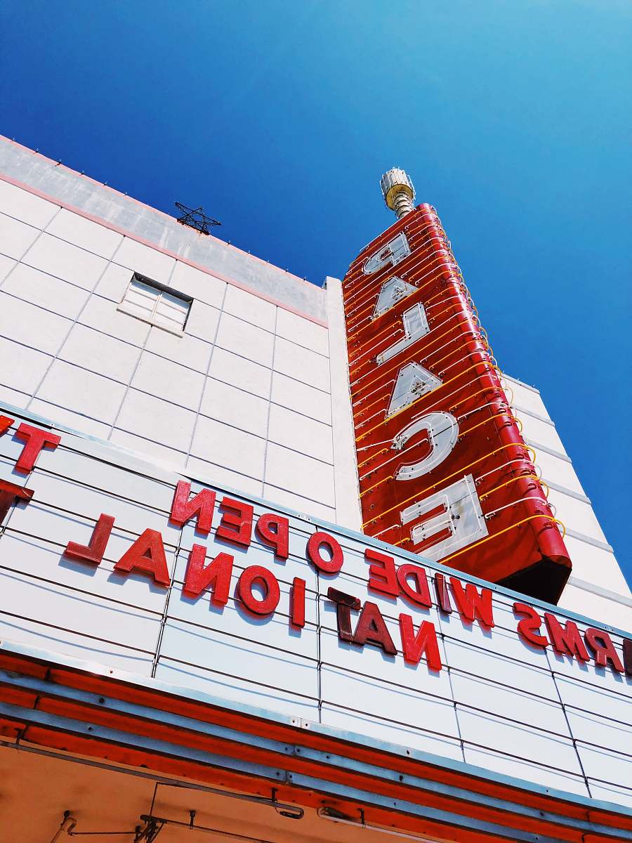 indoors low-angle photography of Palace signage during daytime room